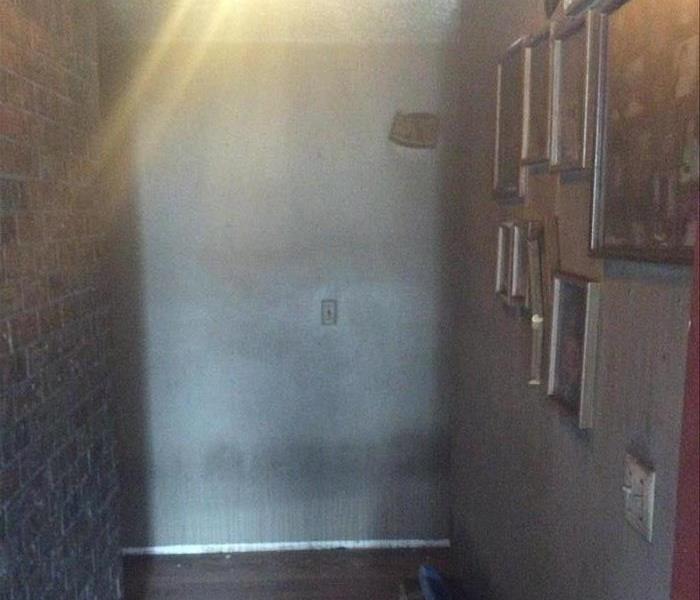 Hallway showing soot and smoke damage.