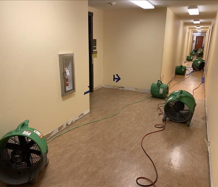 Equipment lined down the hallway of a business.