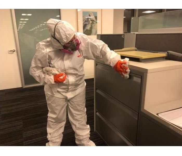 Servpro employee cleaning an office space